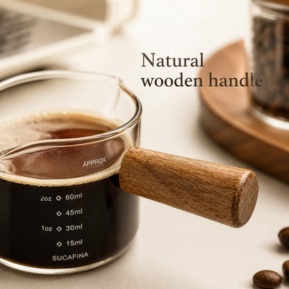 KNOCDIC® 100ml glass espresso measuring cup with a wooden handle for precise coffee measurements.