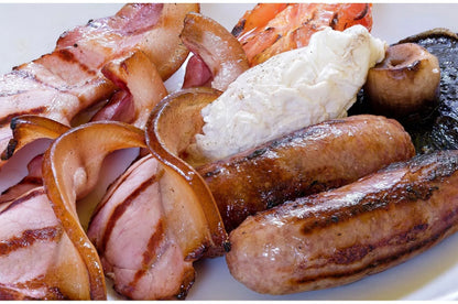 Primrose Herd Cornish breakfast hamper with assorted meat boxes, featuring fresh, locally sourced meats in a rustic gift presentation.