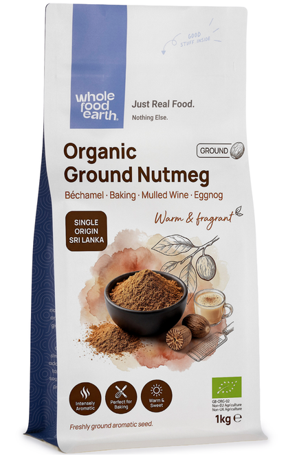 Ground organic nutmeg in a clear glass jar from Whole Food Earth, showing the finely ground spice inside.