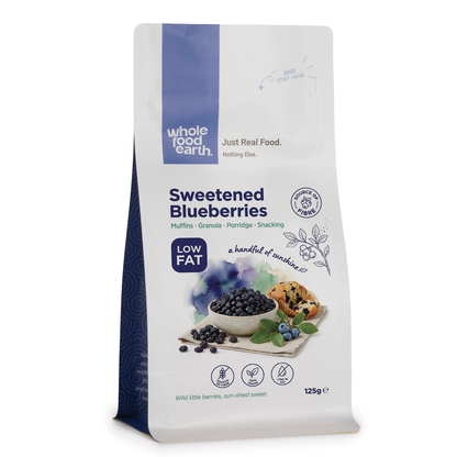 Dried sweetened blueberries from Whole Food Earth, close-up showing shiny, plump blue berries in a clear container.