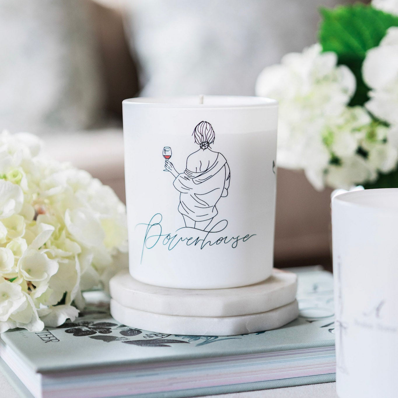 Avalon Home UK Powerhouse Natural Wax Glass Candle with a clear glass container and a lit flame, showcasing a warm, cozy glow.