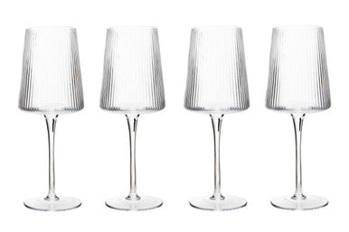 Set of four ribbed MOB wine glasses by Orsina on a plain background