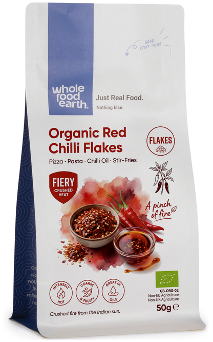 Organic red chili flakes from Whole Food Earth, vibrant dried spicy flakes for cooking and seasoning.