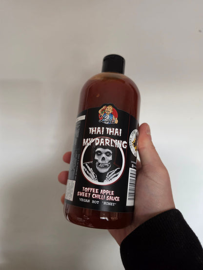 Thai Thai My Darling hot sauce by Lou's Brews, featuring vibrant toffee apple and sweet chili flavors in a condiment bottle.