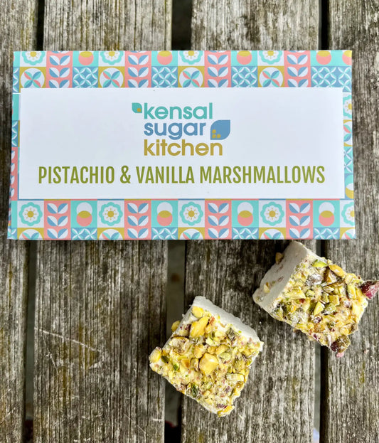 Kensal Sugar Kitchen pistachio and vanilla flavored marshmallows with colorful pastel coating on a white background
