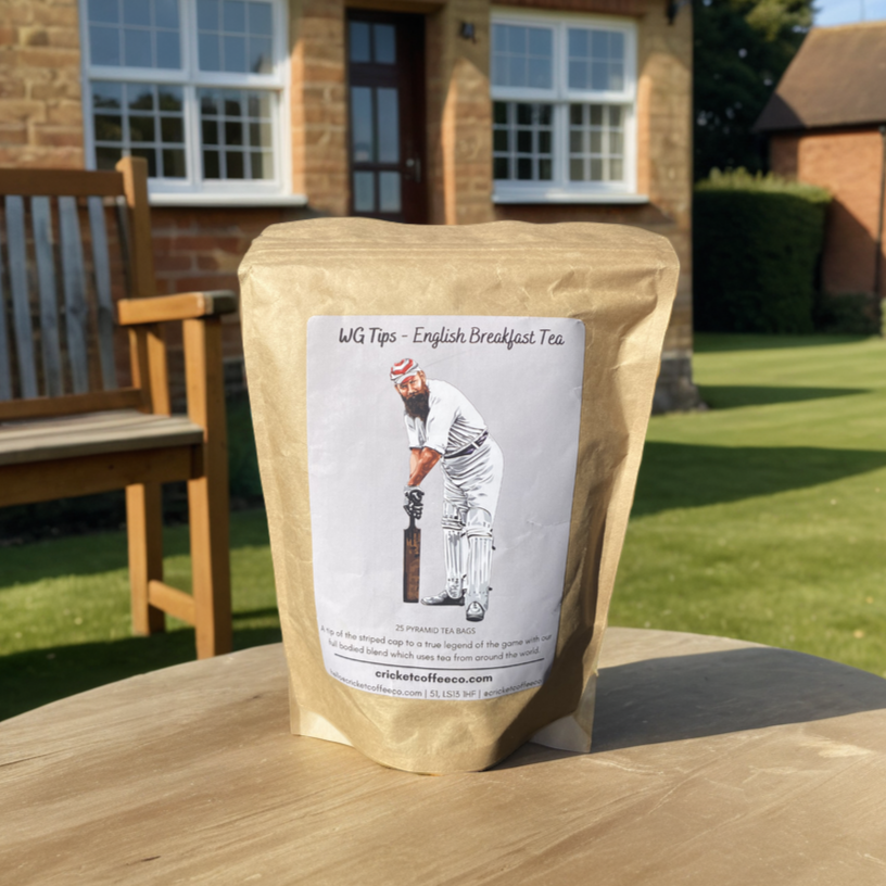 English Breakfast Tea tips from Clubhouse Roastery, displayed in a clear container with loose tea leaves and tea bags.