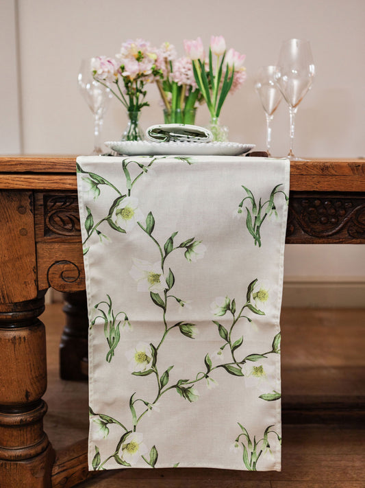 Snowdrop and hellebore floral table runner by Avalon Home UK, featuring delicate spring blooms on a fabric runner.