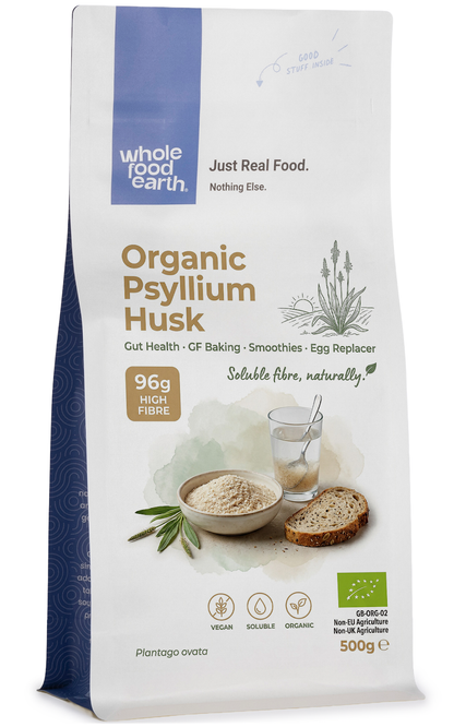 Organic Psyllium Husk from Whole Food Earth, close-up of fine, light brown ground fiber in a bowl, highlighting its natural texture.