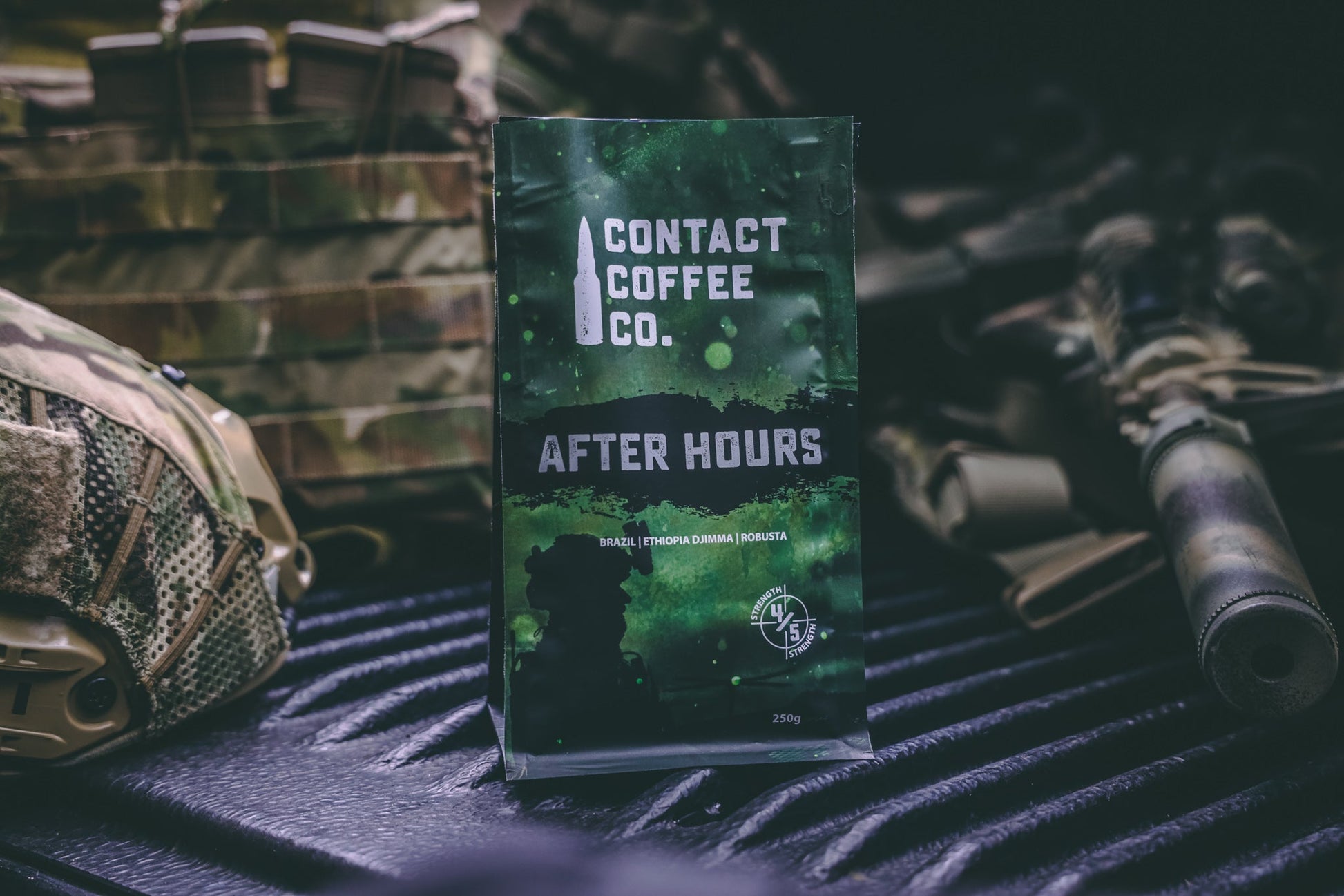 A steaming cup of After Hours Coffee from Contact Coffee Company Ltd. on a wooden table with a cozy background.