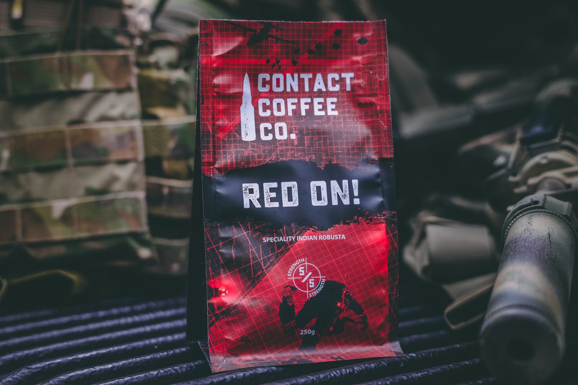 Red On! high-caffeine coffee by Contact Coffee Company Ltd. in a coffee bag with a vibrant red label and bold branding.