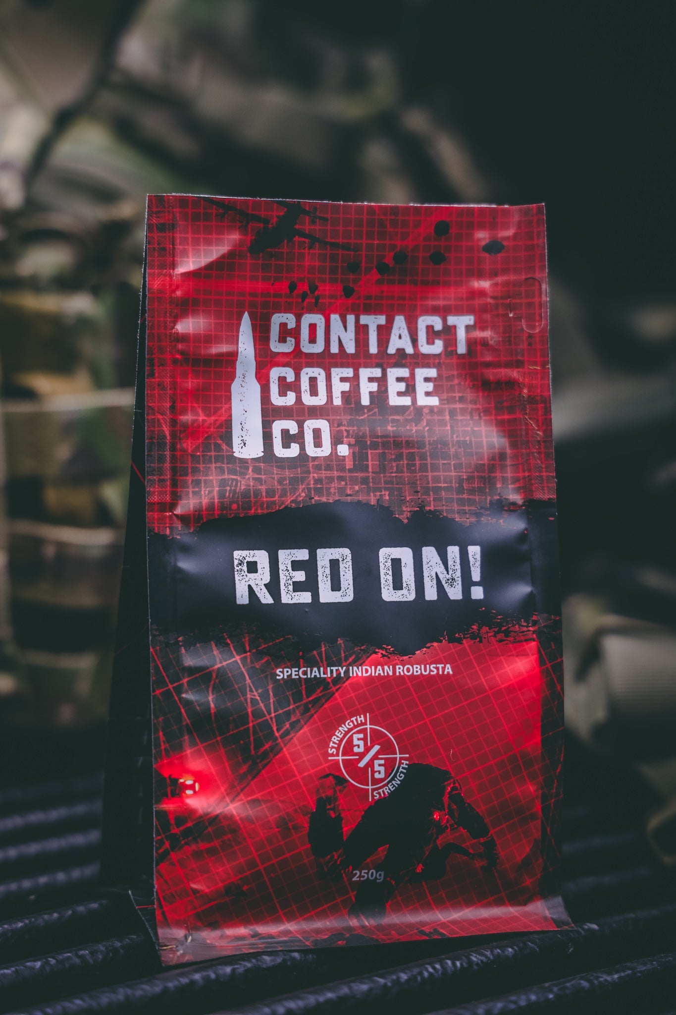 Red On! high-caffeine coffee by Contact Coffee Company Ltd. in a coffee cup with rich, dark brewed coffee visible.