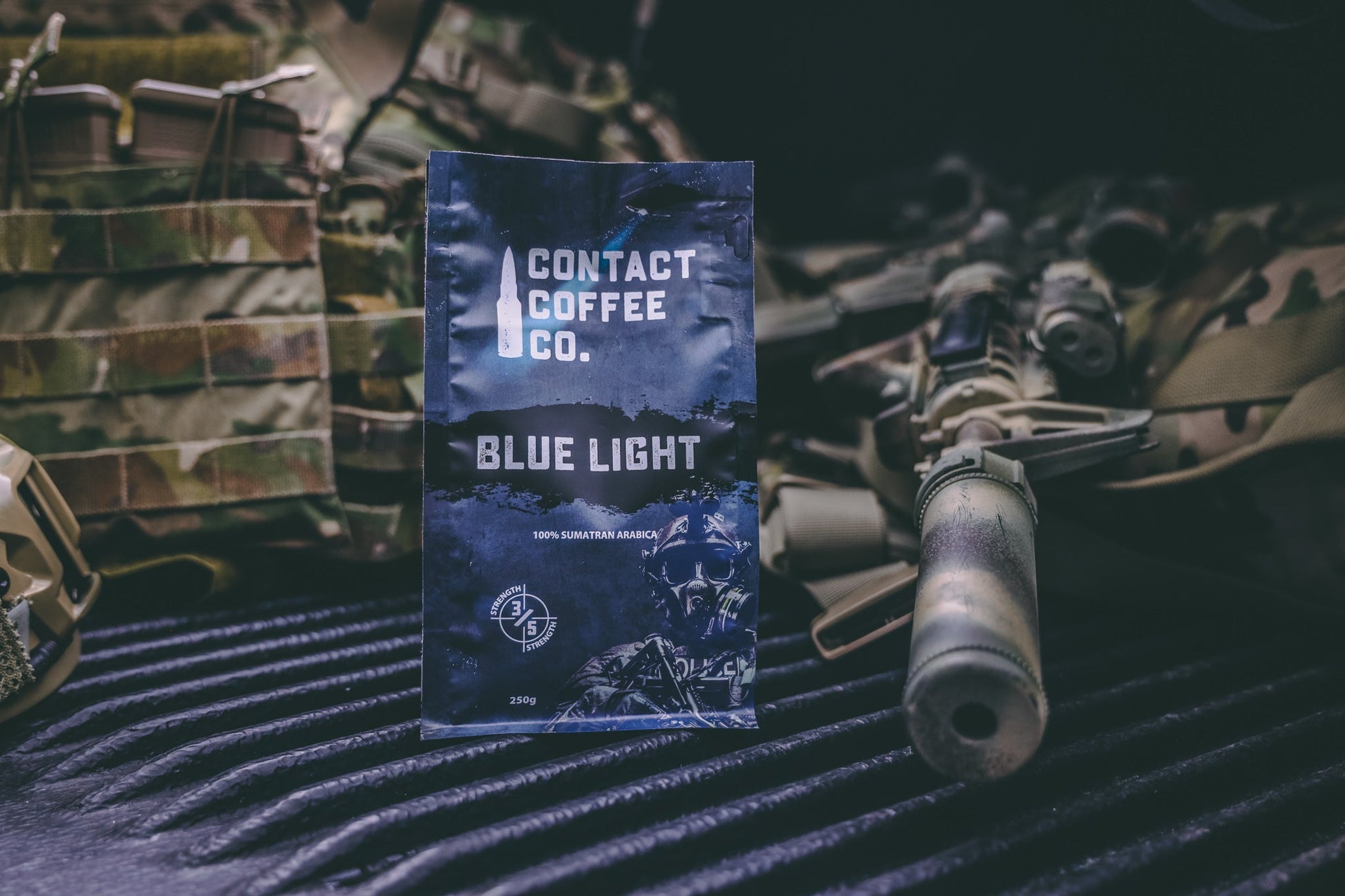 Blue Light Coffee from Contact Coffee Company Ltd., a fresh brewed coffee cup with a blue-themed design on a wooden table.