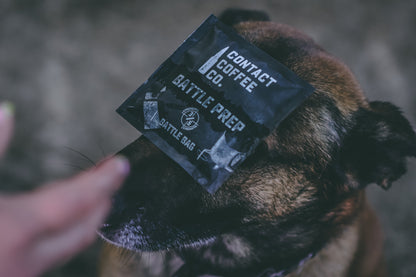 Single serve coffee brew bag from Contact Coffee Company Ltd., ready for brewing, with fresh coffee grounds inside.
