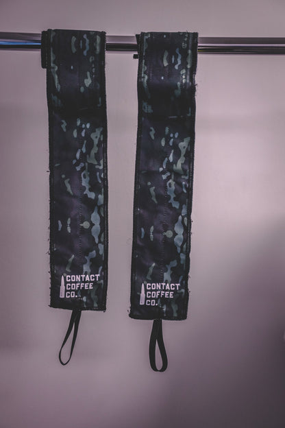 Camo gym wrist wraps from Contact Coffee Company Ltd. with camouflage pattern, designed for support during weightlifting and workouts.