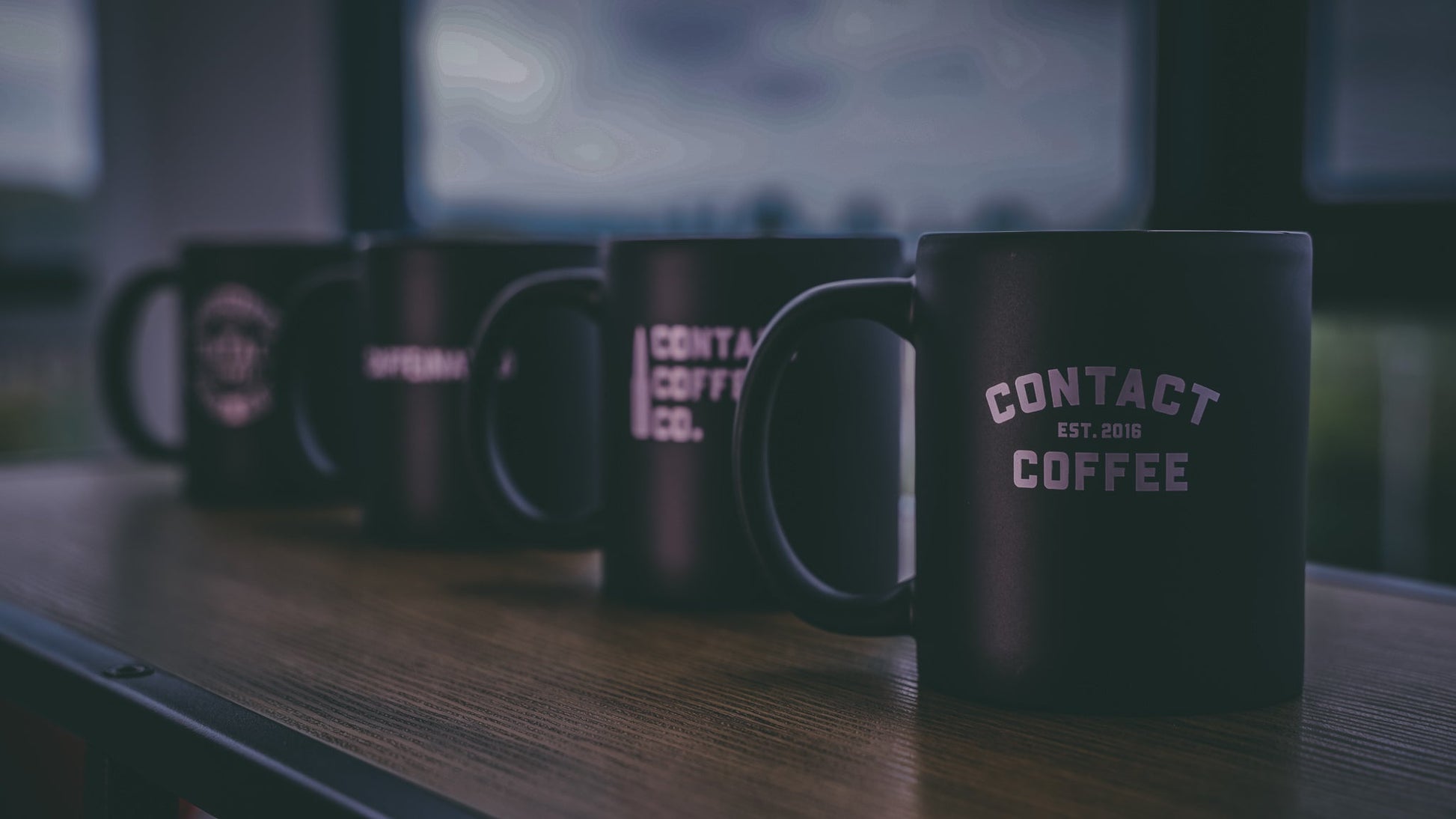 Contact Coffee Co Mug featuring the Charlie gear design, ceramic coffee mug with contact coffee branding and colorful print.