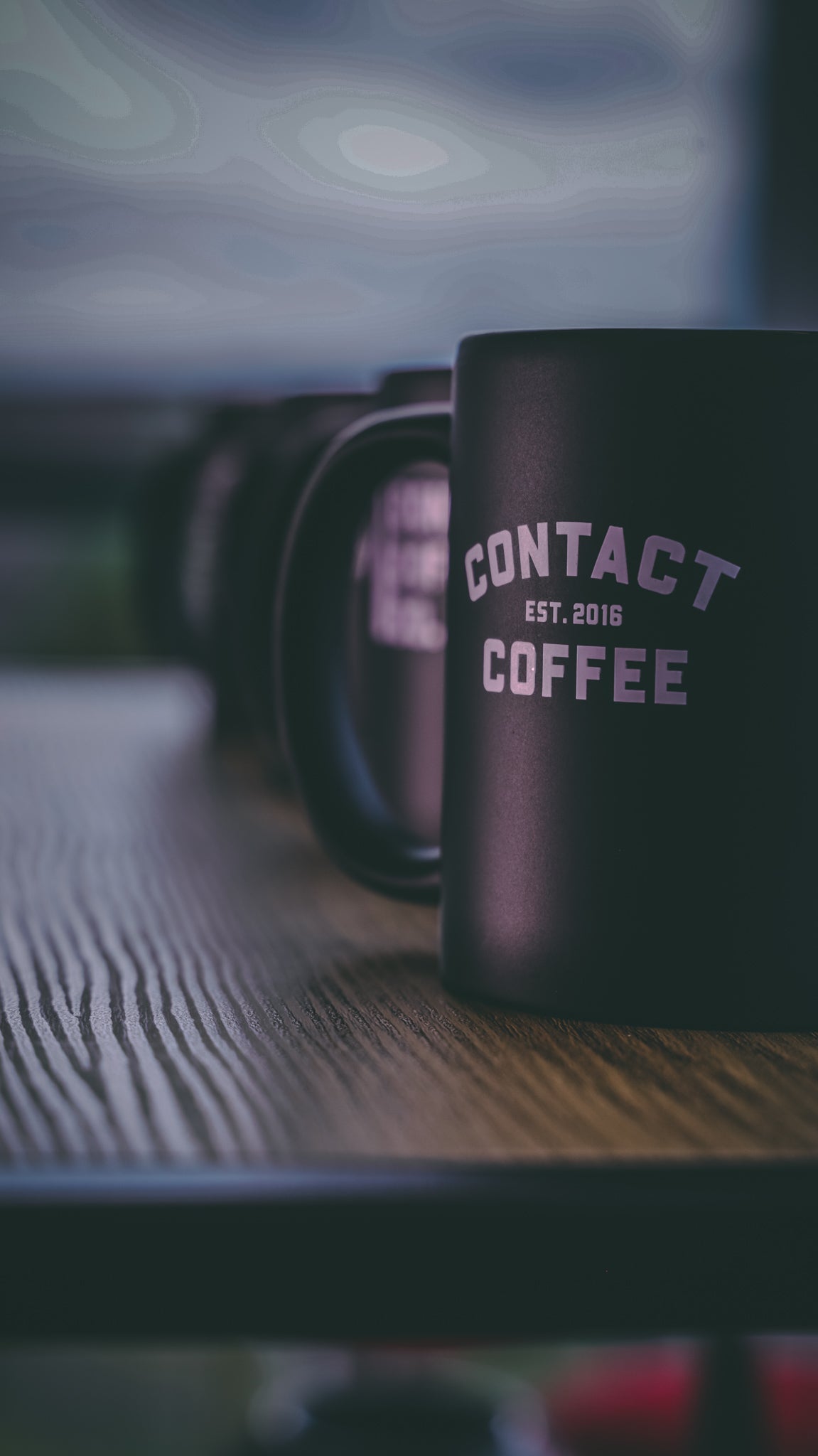 Contact Coffee Co Charlie mug, ceramic coffee gear with logo design, black handle, and white body, perfect for coffee lovers.
