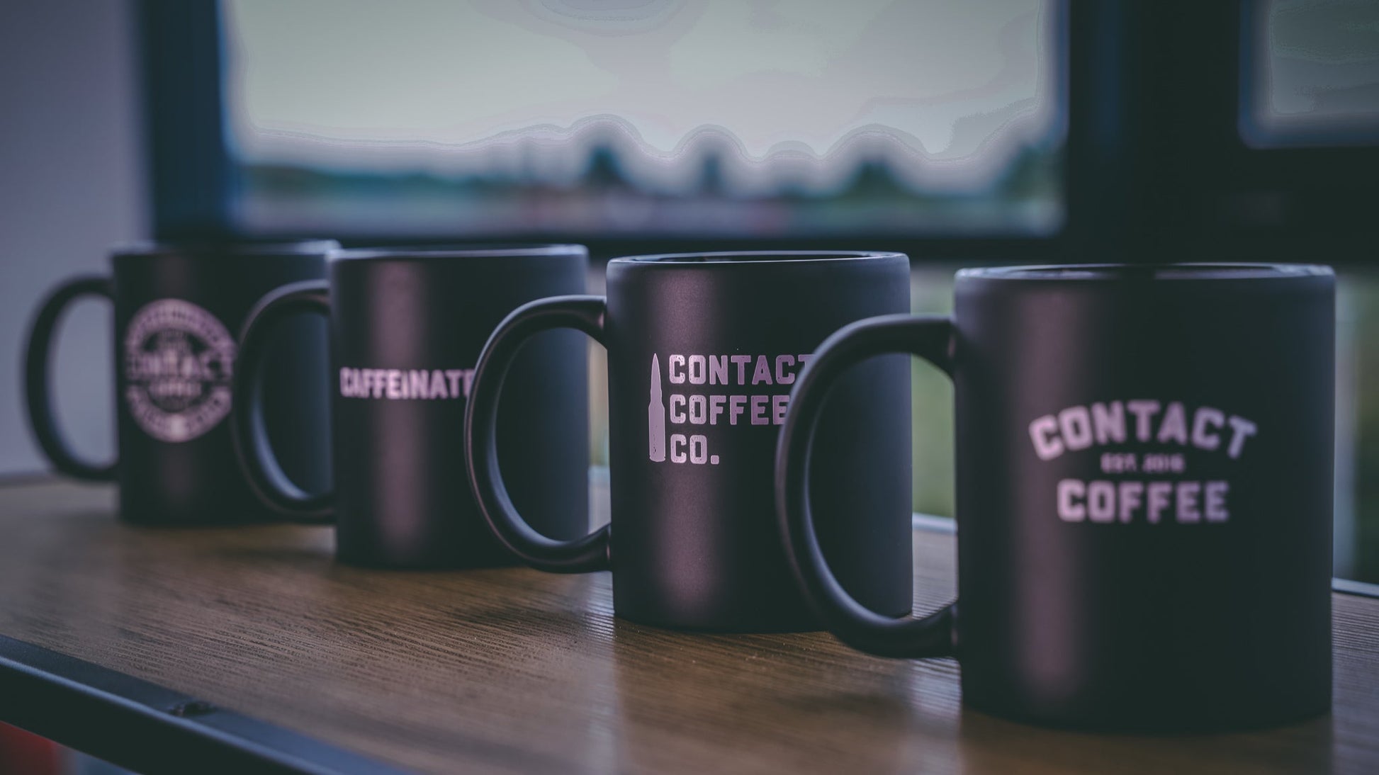 Contact Coffee Co Mug Alpha gear with bold logo, ceramic material, and sturdy handle for everyday coffee drinking.