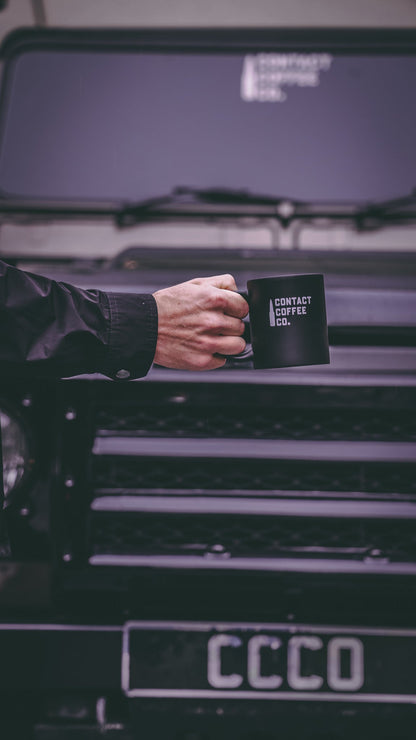 Contact Coffee Co Alpha mug featuring gear design, made of ceramic, with a black handle and logo on a white background.