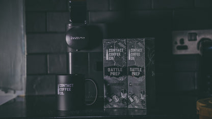 Aluminium Nespresso coffee pods from Contact Coffee Company Ltd. arranged in a row on a white background.