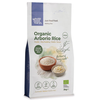 Organic Arborio rice grains from Whole Food Earth, suitable for risotto and cooking, close-up of plump, white rice grains.