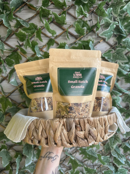 Gurt Lush Food Co granola taster box with assorted flavors in a white box, featuring colorful packaging and variety of granola samples.