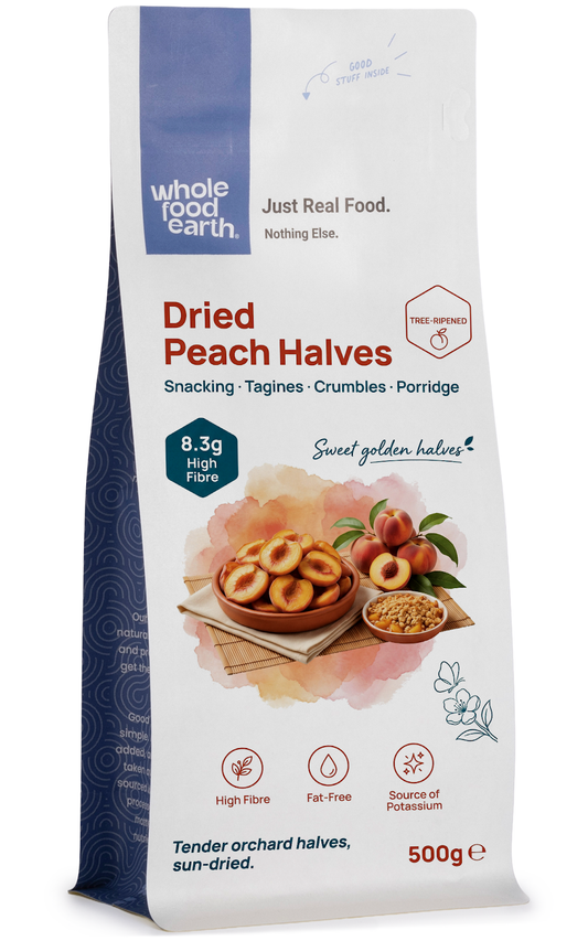 Dried peach halves from Whole Food Earth, a natural dried fruit with tender, sweet peach slices on a white background.