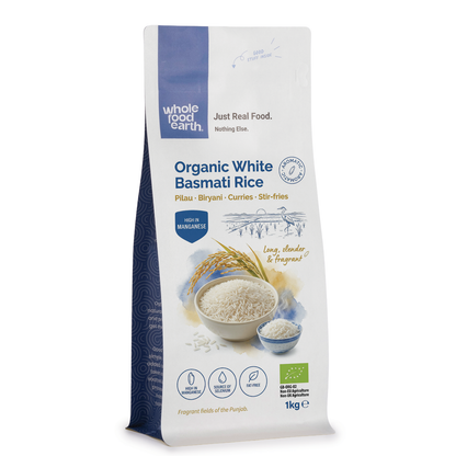 Organic White Basmati Rice from Whole Food Earth, long-grain rice with fluffy texture, displayed in a clear bowl.
