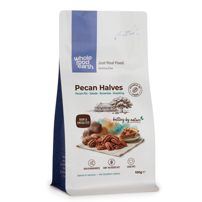 Whole Food Earth pecan halves, crunchy and golden, displayed in a bowl, perfect for snacking or baking.