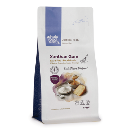 Bag of Whole Food Earth specialty xanthan gum powder for baking and thickening, white fine powder in a resealable bag.