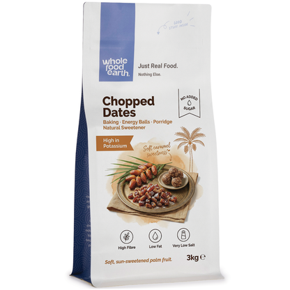 Chopped dried dates from Whole Food Earth, close-up of golden, sticky fruit pieces in a clear bowl, natural and sweet dried fruit product.