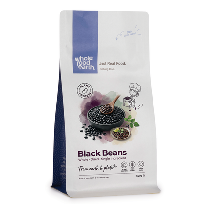 Cooked black beans from Whole Food Earth in a bowl, showcasing shiny black beans and fresh texture.