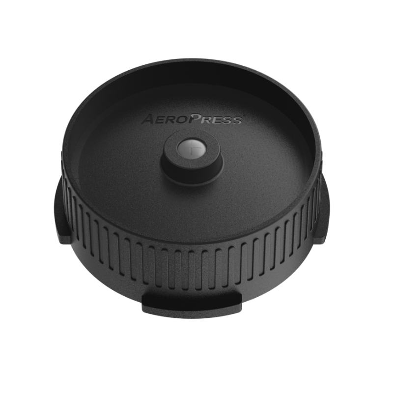 AeroPress Flow Control Filter Cap from Contact Coffee Company Ltd. showing the black plastic gear component with flow control features.