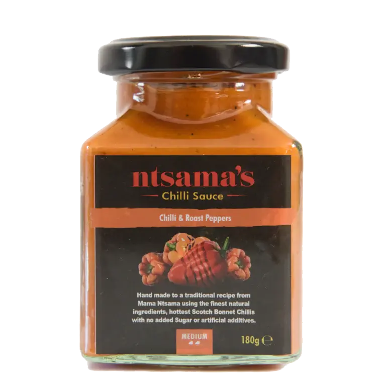 Fire roasted pepper sauce in a glass jar, featuring charred red peppers and spices, from ntsama.co.uk.