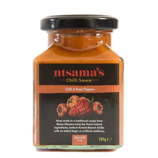 Fire roasted pepper sauce in a glass jar, featuring charred red peppers and spices, from ntsama.co.uk.