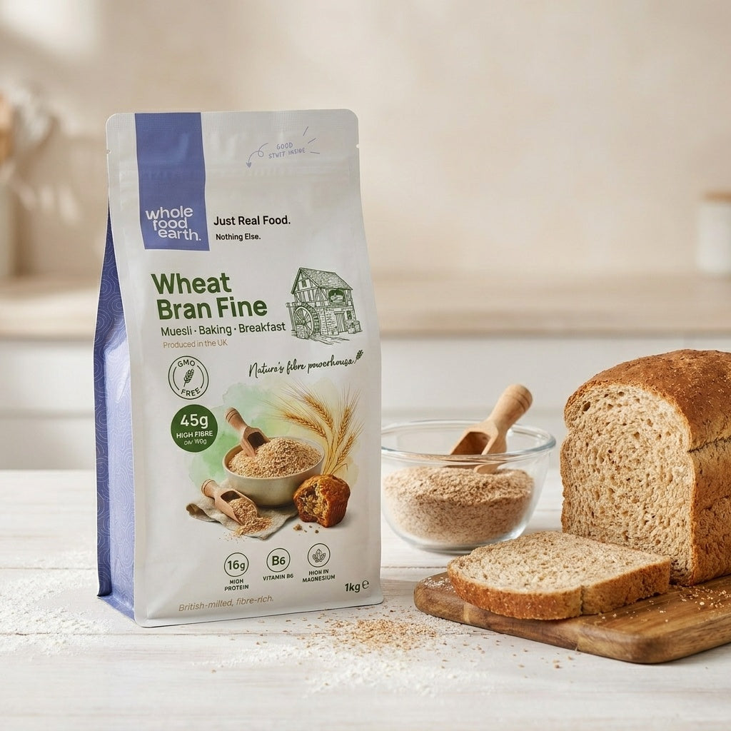 Close-up of Whole Food Earth Wheat Bran Fine cereal in a clear glass bowl with a spoon, highlighting the light, fine texture.