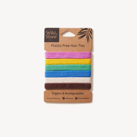 Colorful plastic-free hair ties from Wild And Stone, 6-pack, featuring vibrant, eco-friendly elastic hair ties on a white background.