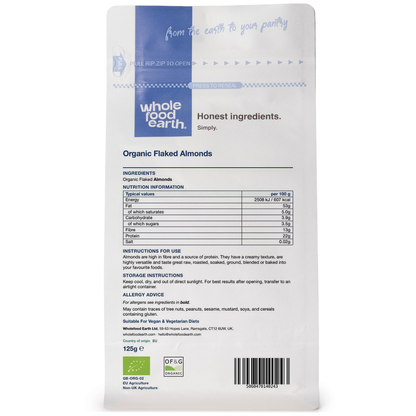 Organic flaked almonds from Whole Food Earth, close-up of golden sliced almonds on a white background, perfect for baking or snacking.