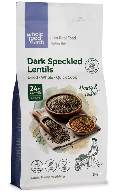 Dark speckled lentils from Whole Food Earth, a type of beans and pulses, shown in a close-up image highlighting their textured surface.