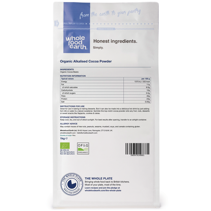 Organic alkalised cocoa powder from Whole Food Earth, showing a container of rich, dark specialty cocoa powder on a wooden surface.