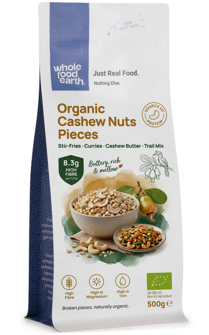 Raw organic cashew nuts pieces from Whole Food Earth, displayed in a bowl, showcasing their creamy, golden appearance.