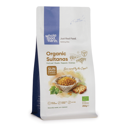 Organic sultanas from Whole Food Earth, close-up of golden dried grapes on a white background