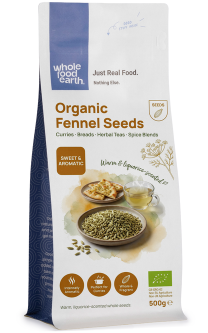 Whole Food Earth organic fennel seeds, fresh herbs and spices, close-up of whole fennel seeds in a clear jar.