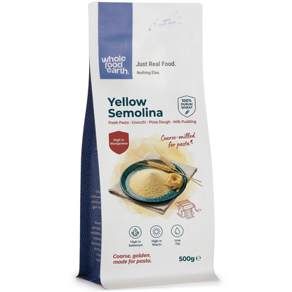Yellow semolina flour from Whole Food Earth, close-up of textured yellow grain in a bowl, ideal for baking and cooking.