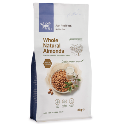Whole Food Earth natural almonds in a clear bowl, showcasing whole, raw almonds perfect for snacking or baking.