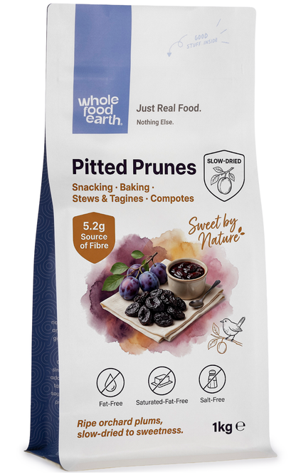 Medium-sized pitted prunes from Whole Food Earth, dried fruit with smooth, dark, and glossy surface, ideal for snacking or baking.