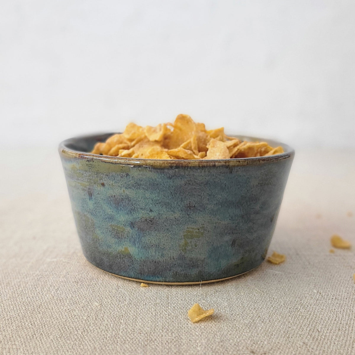Seafoam blue breakfast bowl by Katie L Thompson Designs with a smooth, rounded ceramic design and a glossy finish.