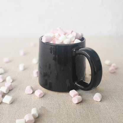 Jet black Classic Standard Mug by Katie L Thompson Designs, featuring a sleek, smooth surface and a comfortable handle.