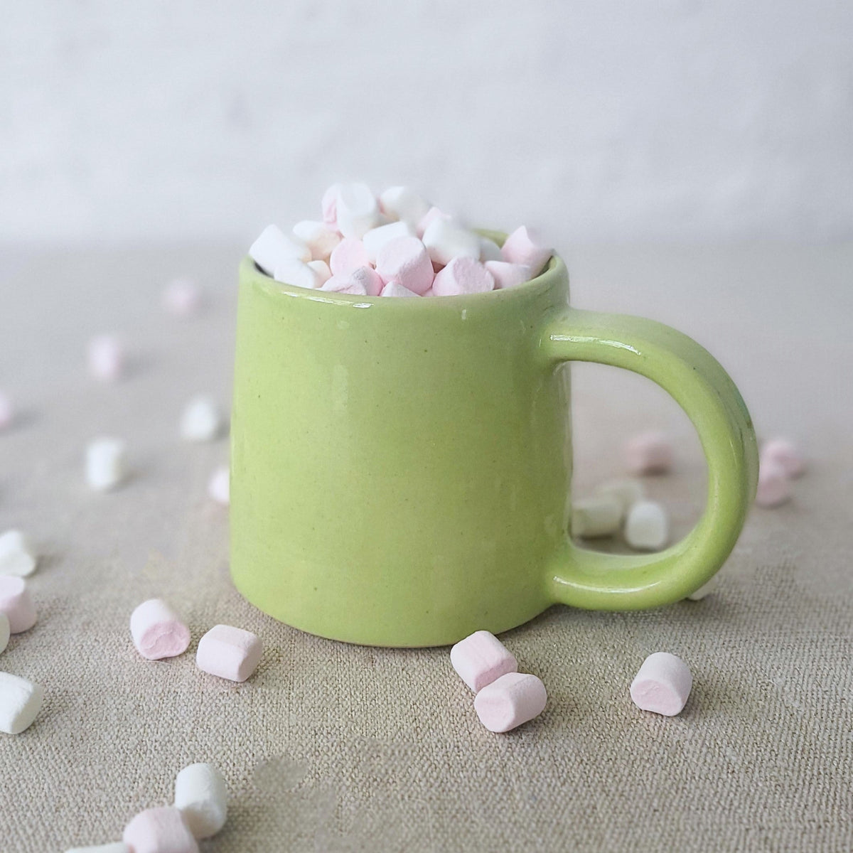 Spring green standard mug by Katie L Thompson Designs, featuring a smooth ceramic surface and classic mug shape.