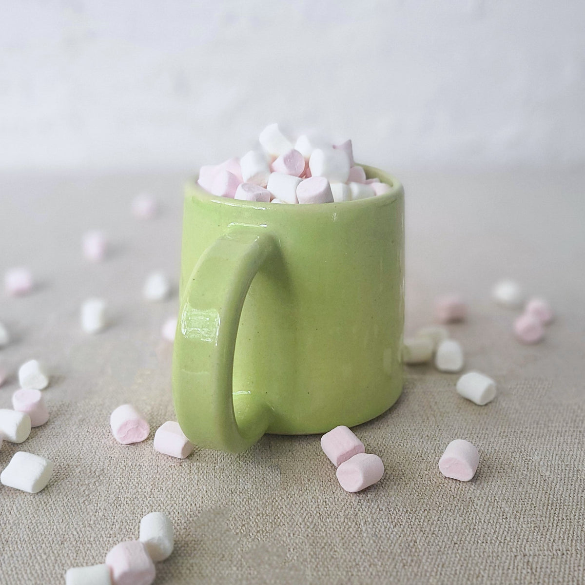 Spring green Katie L Thompson Designs standard mug with a classic shape, featuring a vibrant green color and smooth surface.