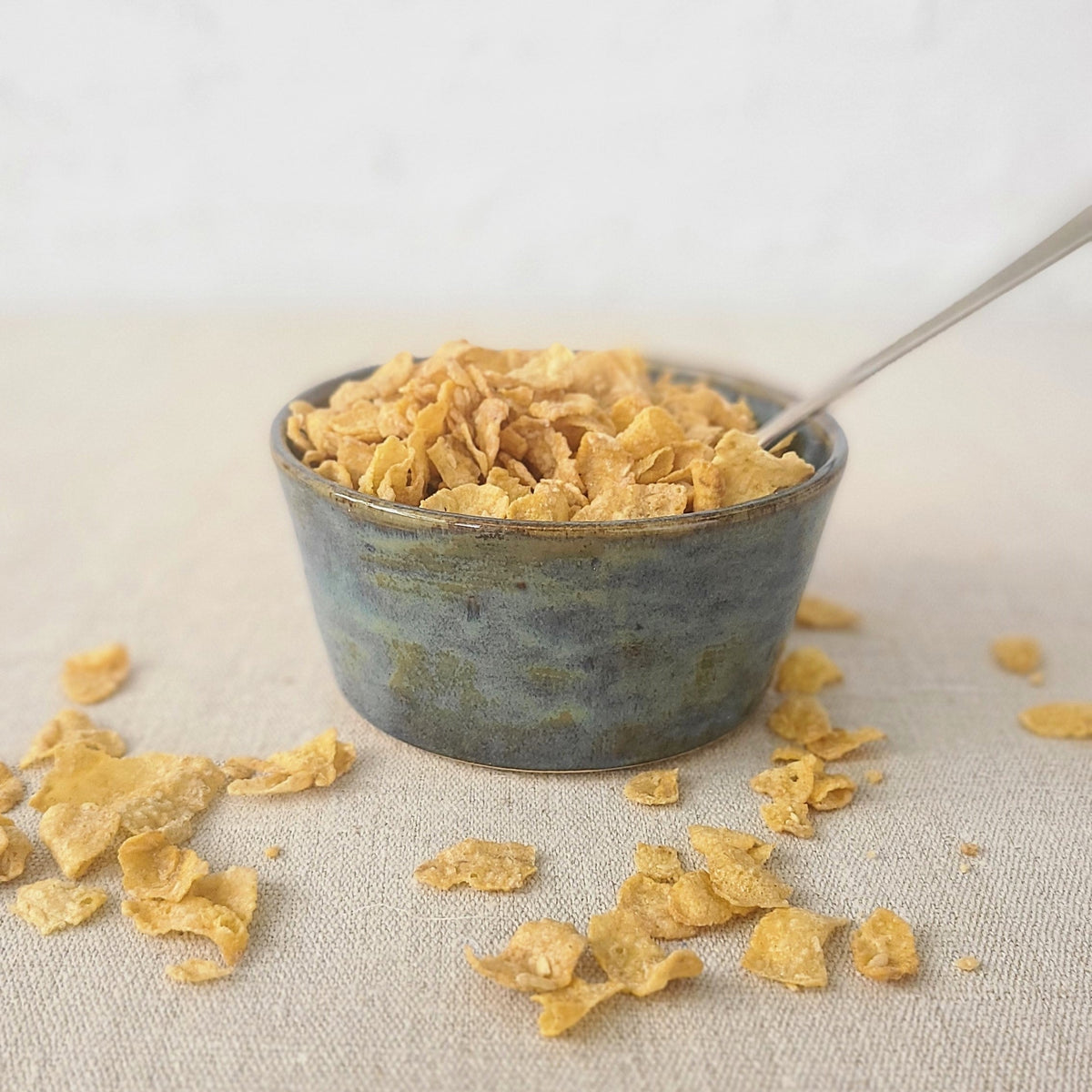 Seafoam blue ceramic breakfast bowl with a classic design by Katie L Thompson Designs, shown on a neutral background.